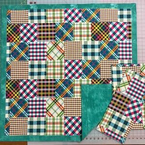 Flannel baby blanket with 2 burp cloths and a crinkle toy